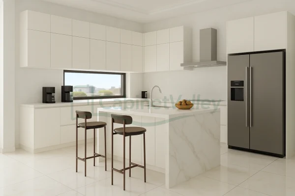 Modern kitchen with glossy white L-shaped cabinets, marble waterfall island, and minimalist flat-panel design.
