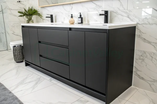 Close-up of sleek black melamine vanity with clean lines and white basin