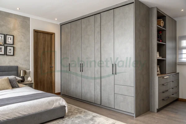 Matte gray wardrobe layout with functional drawers and tall storage units