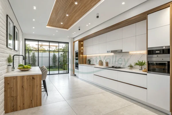 Full view of the modern white L-shaped kitchen with integrated wood accents and a clean open layout